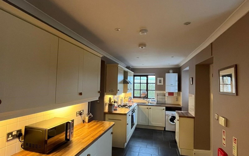 Harford House Kitchen Kitchen floors are tiled and level throughout to the dining room and to the lobby area.  Doors are standard width.  Room is lit by natural light from 3 windows or overhead and under unit lighting.