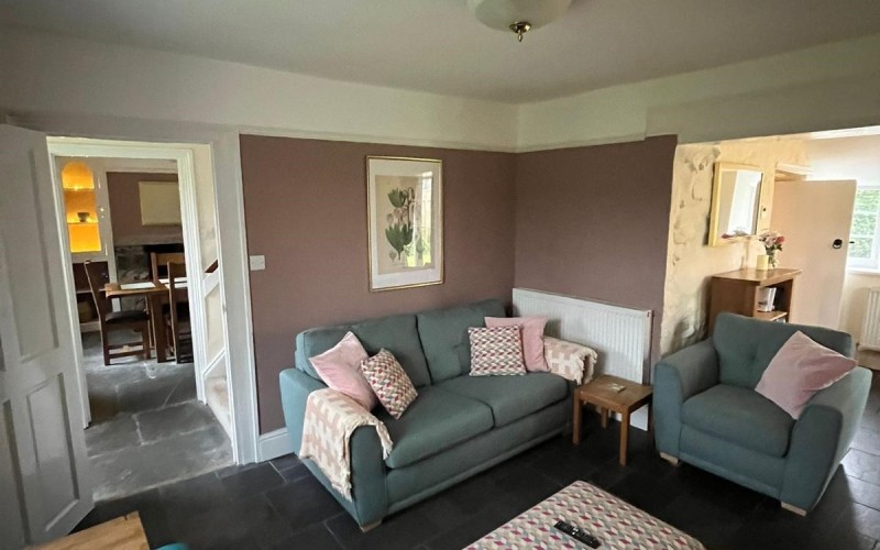 Harford House Lounge The floors are level and tiled into the dining room with a 1in (2.5cm) wooden threshold to the natural slate hallway floor.  Doors are standard width.