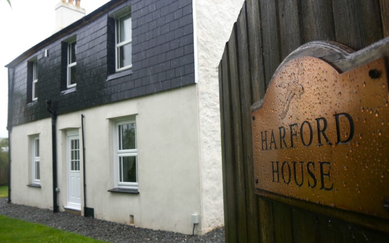 Harford House access from the holiday park Access is over level gravel path. Front door has threshold 7in (17cm)