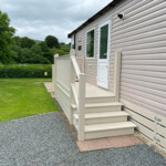 Holiday caravan access steps to side decking area. Holiday caravan access steps to side decking area.